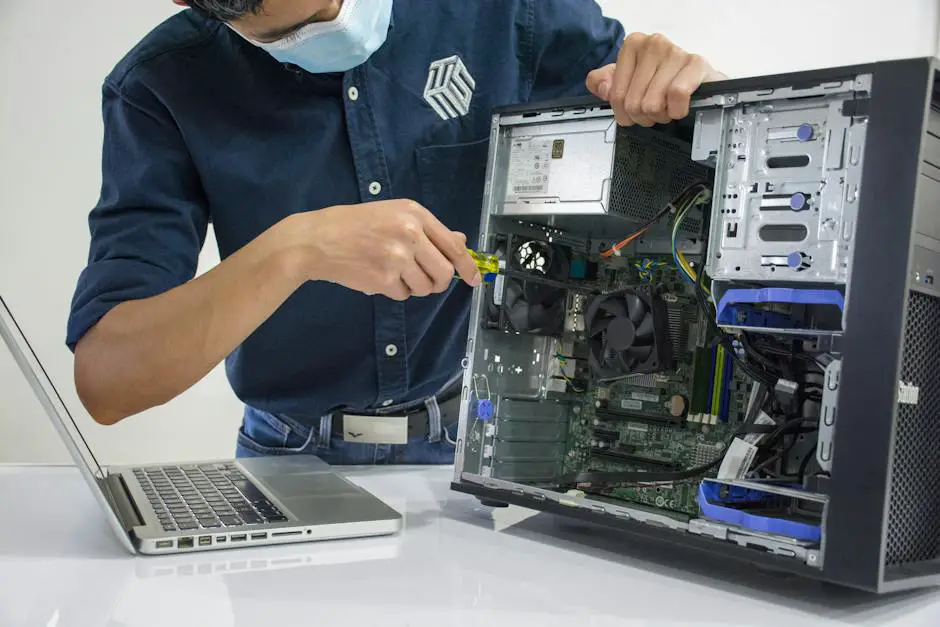 Image displaying a laptop being troubleshooted by a technician